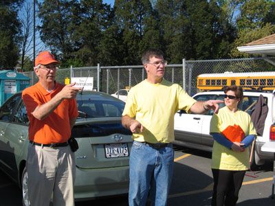 Supervisor Eugene Delgaudio joins other leaders of the Sterling community in meeting up April 29 and picking up trash on Sterling Boulevard. Mowing costs are raised by donations to the recycling bin at Park View High School in the background. 